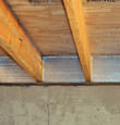 SilverGlo™ insulation installed in a floor joist in Lewisville