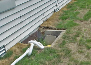 old concrete window well of a Arlington crawl space