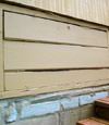 an old-fashioned crawl space door in Allen about to be replaced