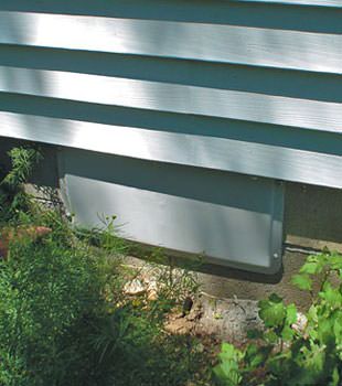 A gray crawl space vent cover in North Richland Hills