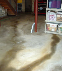 Flooding entering a basement through a floor crack in Flower Mound
