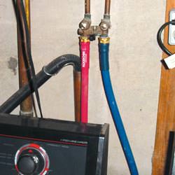 Washer hoses in a basement  in Frisco