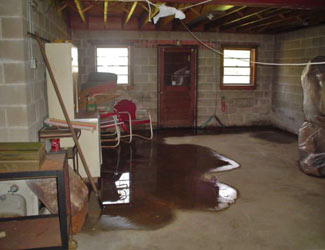 a flooded basement floor in a Duncanville home