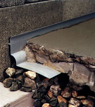 a custom designed basement drain system for thin basement floors in Grapevine.