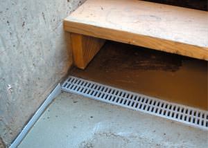 a hatchway entrance in Flower Mound that has been protected from flooding by our TrenchDrain basement drainage system.