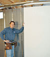Installing wall panels on top of our basement wall insulation in Mesquite