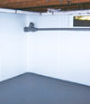 Arlington, TX wet basement wall covering that tucks into a perimeter drainage system