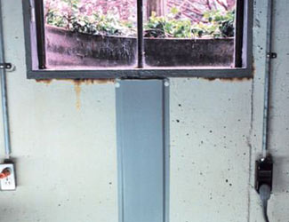 Repaired waterproofed basement window leak in Garland