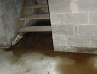 Water Pouring into a Lewisville Basement through Hatchway Doors